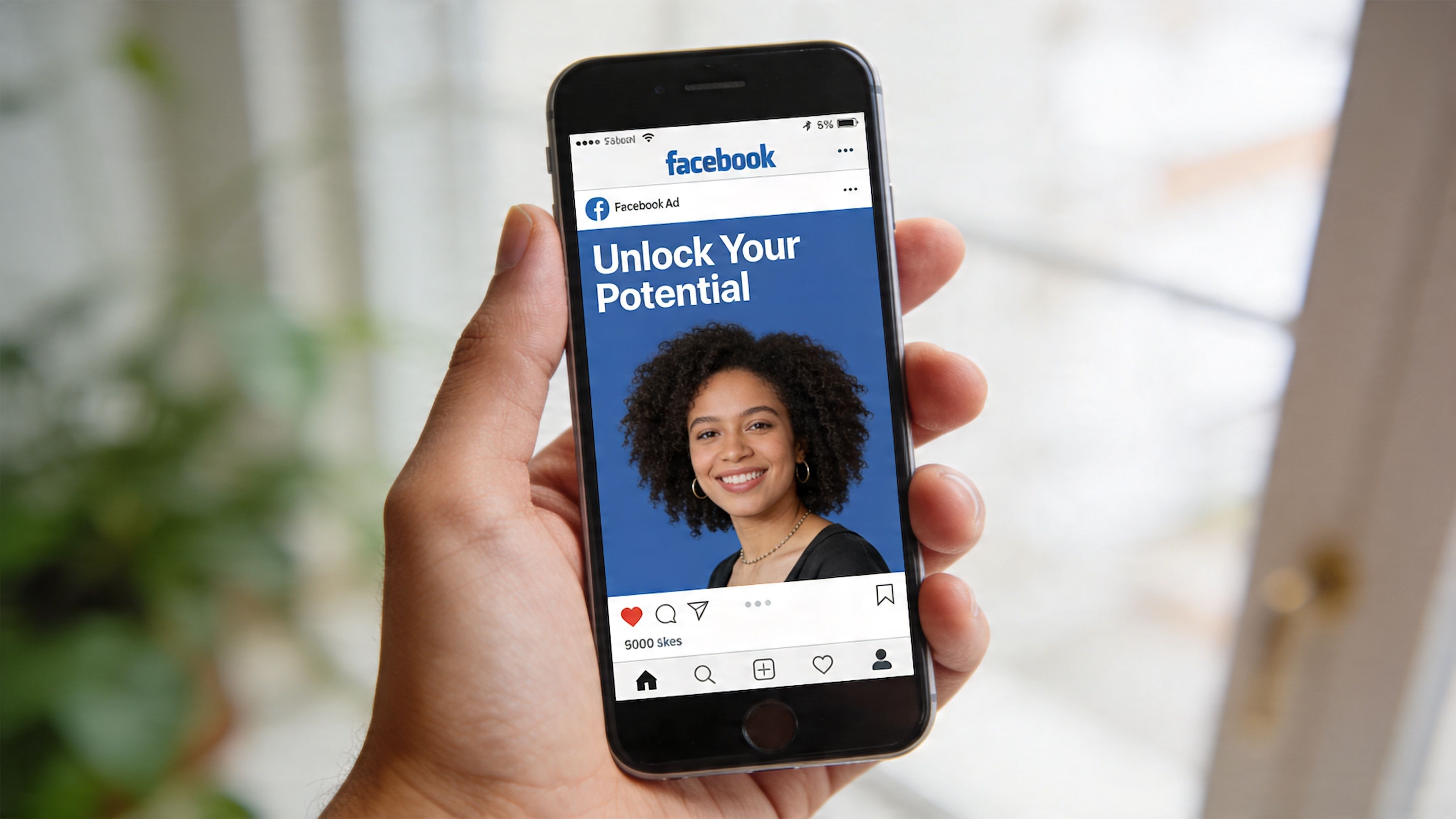 A hand holding a smartphone displaying a Facebook advertisement with a photo of a smiling woman.